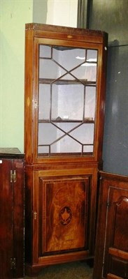 Lot 849 - An inlaid mahogany corner cupboard