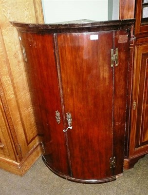 Lot 850 - Georgian mahogany bowfront corner cupboard