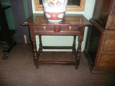 Lot 856 - An early 18th century oak single drawer side table