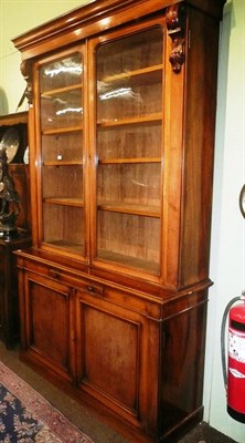 Lot 872 - Victorian mahogany glazed bookcase on cupboard base