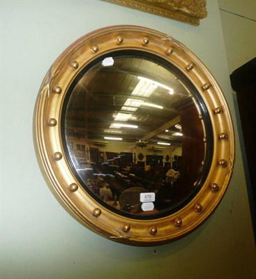 Lot 876 - A 19th century Regency style convex mirror