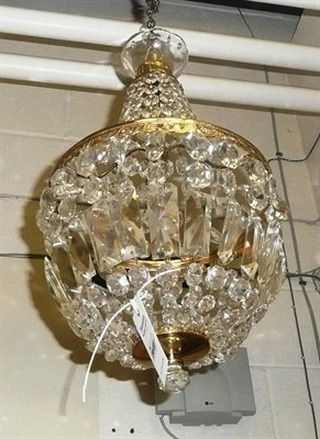 Lot 883 - A gilt metal light fitting with crystal drops