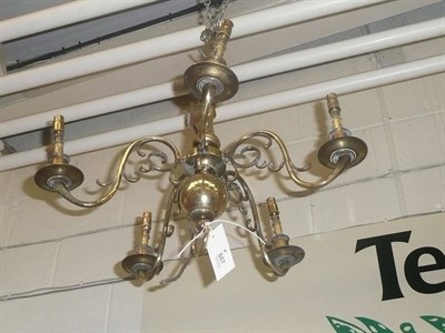 Lot 887 - Dutch brass five branch candelabra