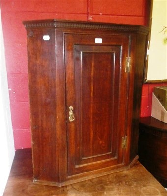 Lot 923 - Georgian oak panelled corner cupboard