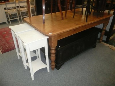 Lot 960 - Large pine kitchen table, two white painted bedside tables and a reproduction panelled oak...