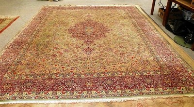 Lot 987 - Large Kirman carpet with pale green field