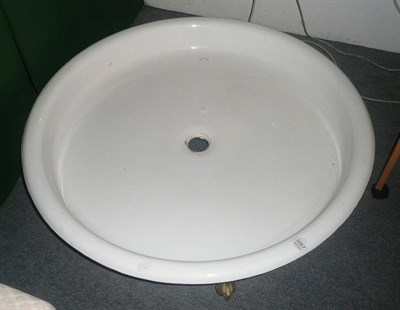 Lot 1057 - A Victorian enamelled circular shower tray on ball and claw feet