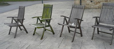 Lot 1062 - Seven hardwood garden armchairs