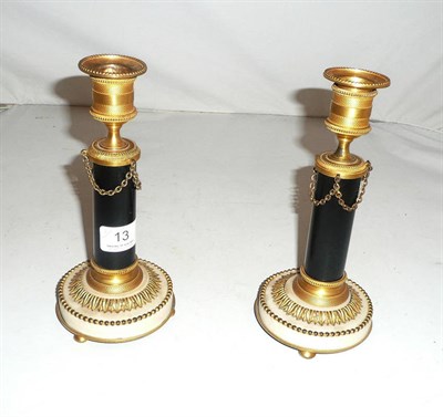 Lot 13 - A pair of marble and gilt metal mounted table candlesticks