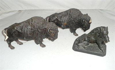 Lot 15 - Two spelter buffaloes and a brass boar