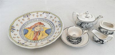 Lot 21 - A faience plaque and a early 19th century part childs tea set