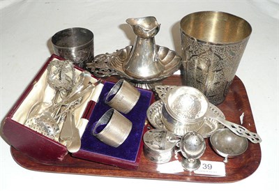 Lot 39 - Pair of cased silver napkin rings, silver tea strainer and stand, silver jug (a.f.), silver...