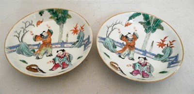 Lot 59 - A pair of 19th century Chinese porcelain saucer dishes depicting boys playing