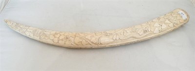 Lot 61 - A carved ivory tusk