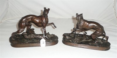 Lot 74 - A pair of spelter figures modelled as a greyhound with a dead hare, the other with a peacock