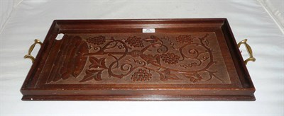 Lot 75 - A carved wood 'vine' decorated tray with initials WM within a heart