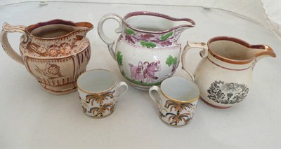 Lot 78 - Two early 19th century coffee cans and three pink lustre decorated jugs