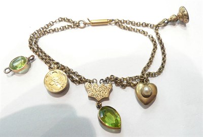 Lot 89 - A bracelet with peridot drops, seals and a compass