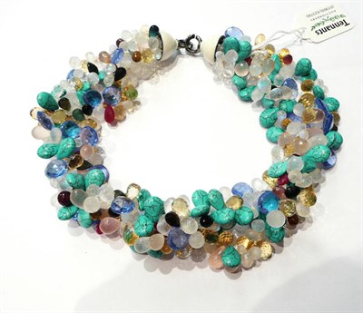 Lot 123 - A multi stone torsade including citrine, tourmaline, reconstructed turquoise, moonstone etc