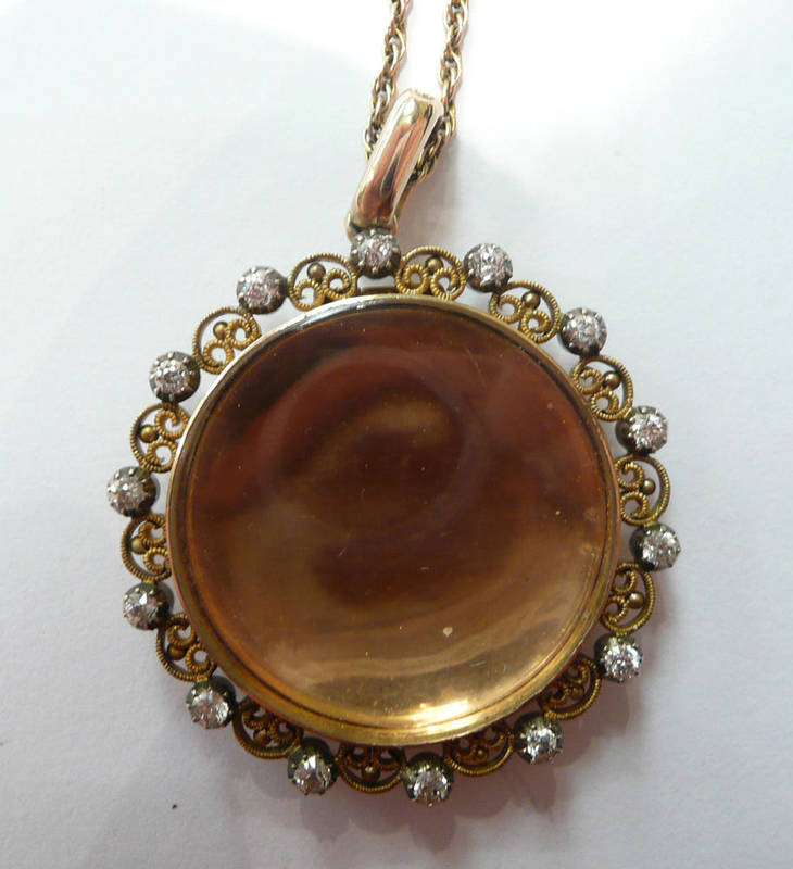 Lot 127 - A diamond set locket pendant on chain