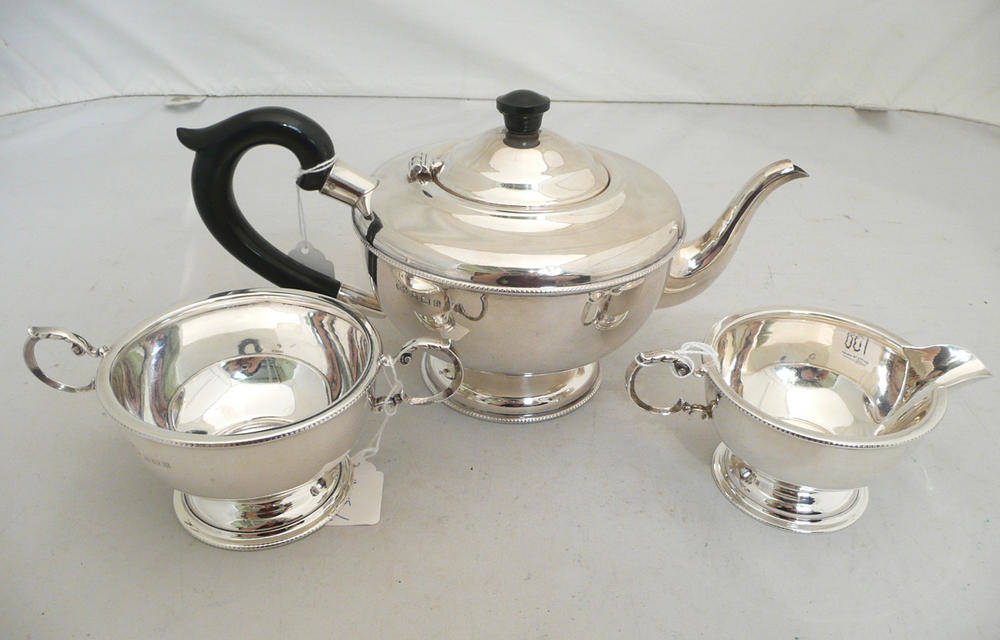 Lot 138 - Silver three piece tea service, 20 oz