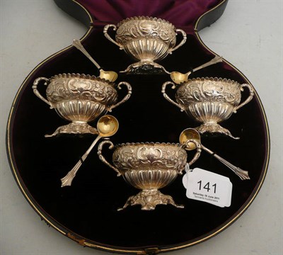Lot 141 - Four silver gilt salts in a fitted case, 5.5 oz