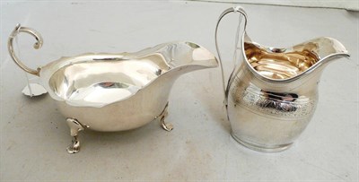 Lot 144 - Silver cream jug and Chester silver sauce boat, 8.1 oz