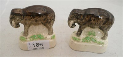 Lot 166 - A pair of Staffordshire elephants (2)