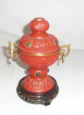 Lot 188 - A cinnabar lacquer twin-handled vase