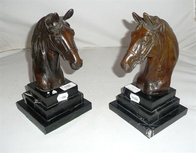Lot 192 - A pair of bronze horses heads