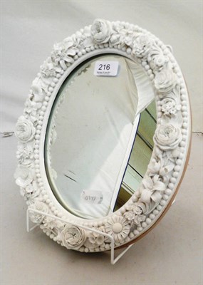 Lot 216 - White glazed flower encrusted mirror