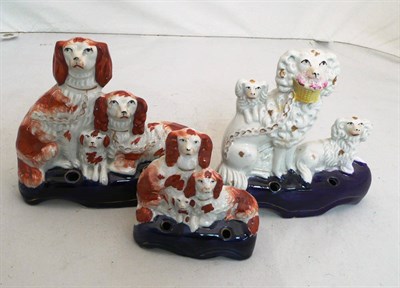 Lot 225 - A Staffordshire spaniel group quill holder, and two others (3)