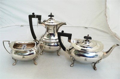 Lot 229 - A Walker and Hall three piece silver tea service bearing crest, total weight 47 oz