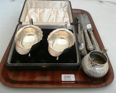 Lot 230 - Two silver sauce boats, a white metal jug and four pieces of cutlery