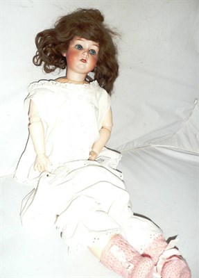 Lot 235 - Gebruder Heubach bisque socket head doll with sleeping blue eyes, original brown wig, open...