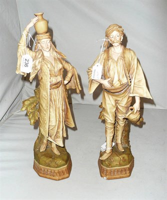 Lot 236 - A pair of Royal Bonn Eastern water carrier figures