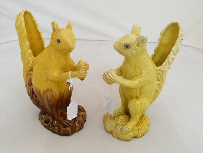 Lot 237 - A pair of yellow ground pottery squirrels