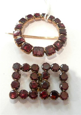 Lot 301 - A foil backed garnet hoop brooch (a.f.) and a buckle