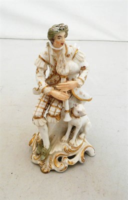 Lot 319 - Derby figure of a bag piper and dog (a.f.)