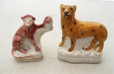 Lot 361 - A Staffordshire monkey and a leopard (2)