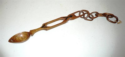 Lot 370 - A Welsh carved wood 'love' spoon