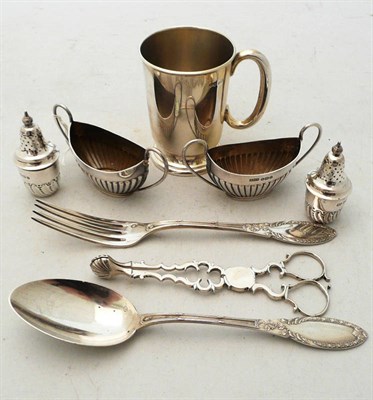 Lot 374 - A pair of sugar nips, two salts, two pepperettes, a spoon and fork and a small mug, 8 oz