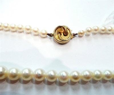 Lot 379 - A stand of cultured pearls with a 9ct clasp