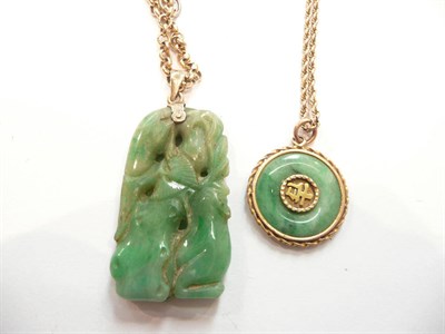 Lot 380 - A jade type pendant inset with a Chinese symbol on chain and a carved jade type pendant on...