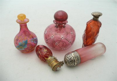 Lot 381 - A group of five Victorian and later ruby glass scent bottles