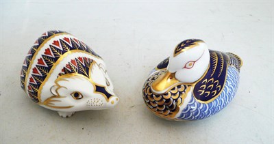 Lot 383 - Two Royal Crown Derby paperweights - duck and hedgehog