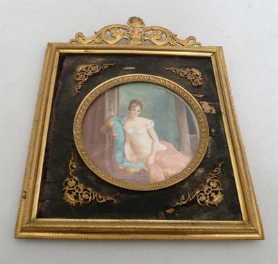 Lot 399 - An ivory circular miniature portrait of  'Mme Decamiere' in an ormolu frame signed A....