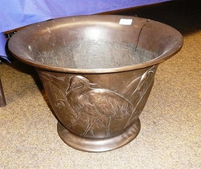 Lot 407 - A bronzed planter decorated in relief