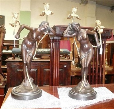 Lot 425 - A pair of Art Nouveau gilt bronze figural candlesticks