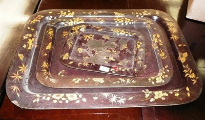 Lot 428 - A set of three 19th century graduated papier mache trays